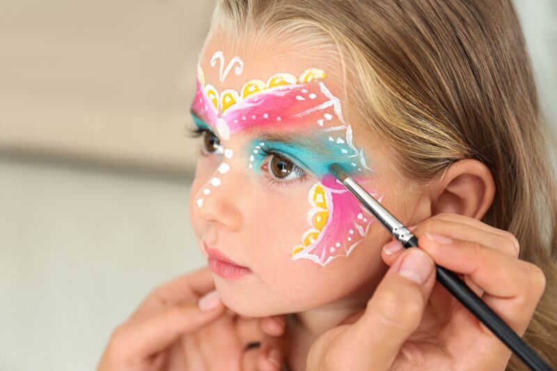Face painter butterfly themed 1st birthday party ideas