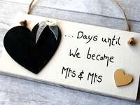 Chalkboard heart with '...Days until we become Mrs & Mrs' on white wooden sign