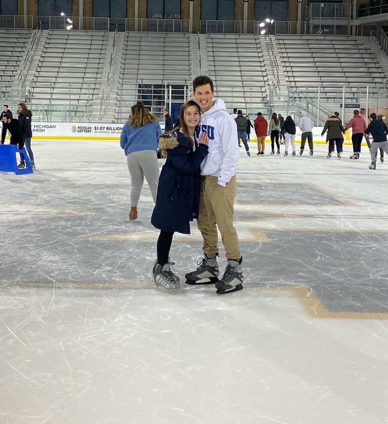 Hannah and Adam were introduced by Hannah's college roommate and Adam's lifelong friend, Olivia, at a Christmas Party in December 2020. They went on just three dates before deciding to make it official on January 14, 2020. Here is a photo of one of their first dates as an official couple at the Yost Arena at the University of Michigan (Hannah's alma mater).  