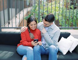 Engaged couple making their wedding registry