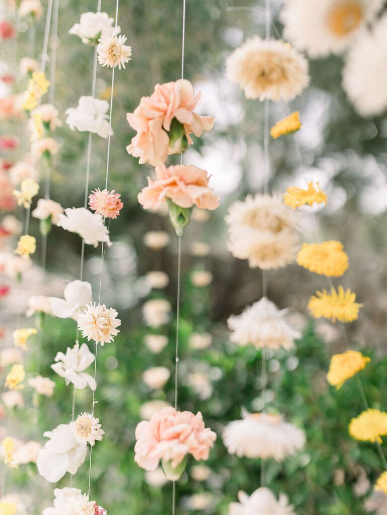 Carnation floral curtain on string at wedding reception