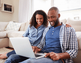 Couple looking at laptop