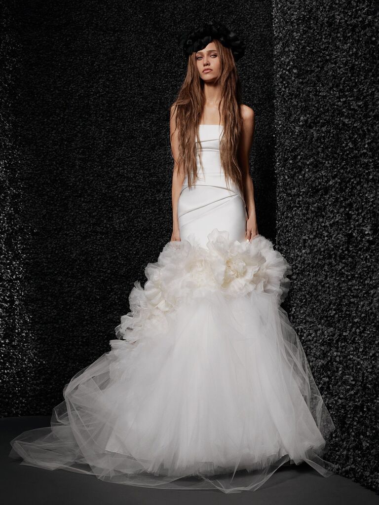 Model wears a strapless Vera Wang wedding gown, best floral wedding dresses 2023-2024. 
