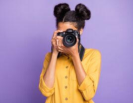 Photgrapher taking a picture with her camera