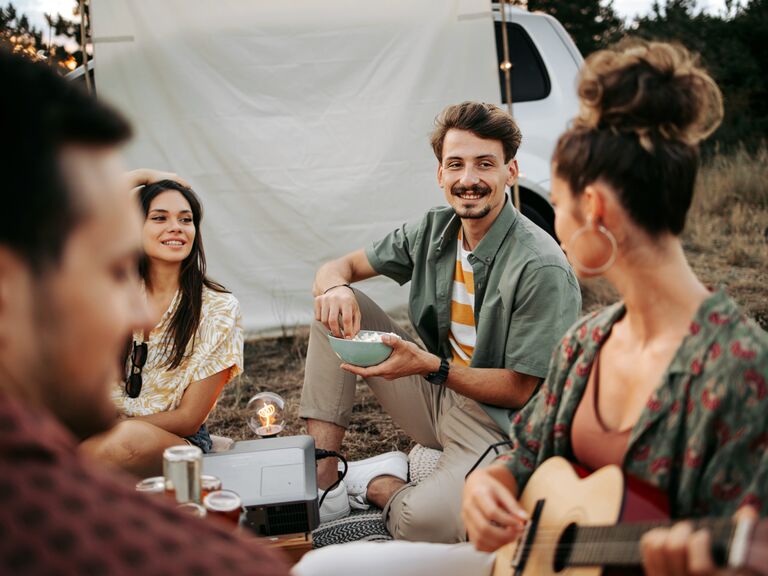 Two couples sharing a camping trip