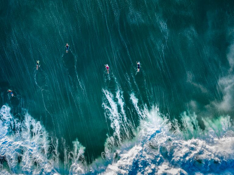 A bird's eye view of surfers near Bali, Indonesia.
