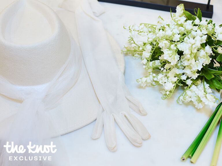 Bridal hat with gloves and bouquet at Jenny Yoo bridal salon