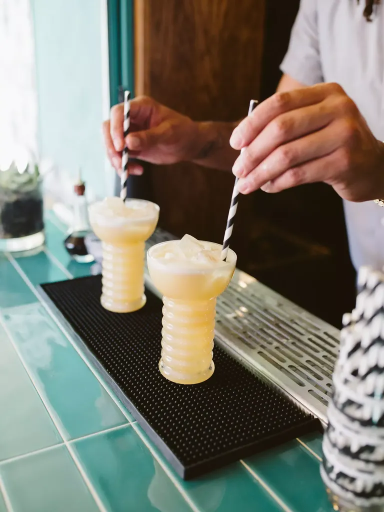 Frozen pina colada cocktail for signature wedding drink idea
