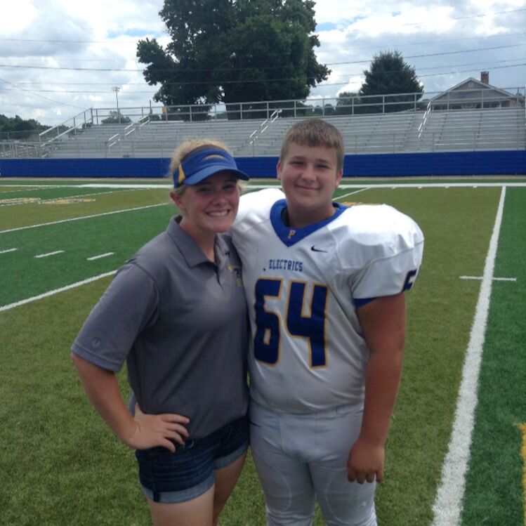 Football picture day Maggie's freshman year. Not sure if we had ever spoken before this picture was taken.