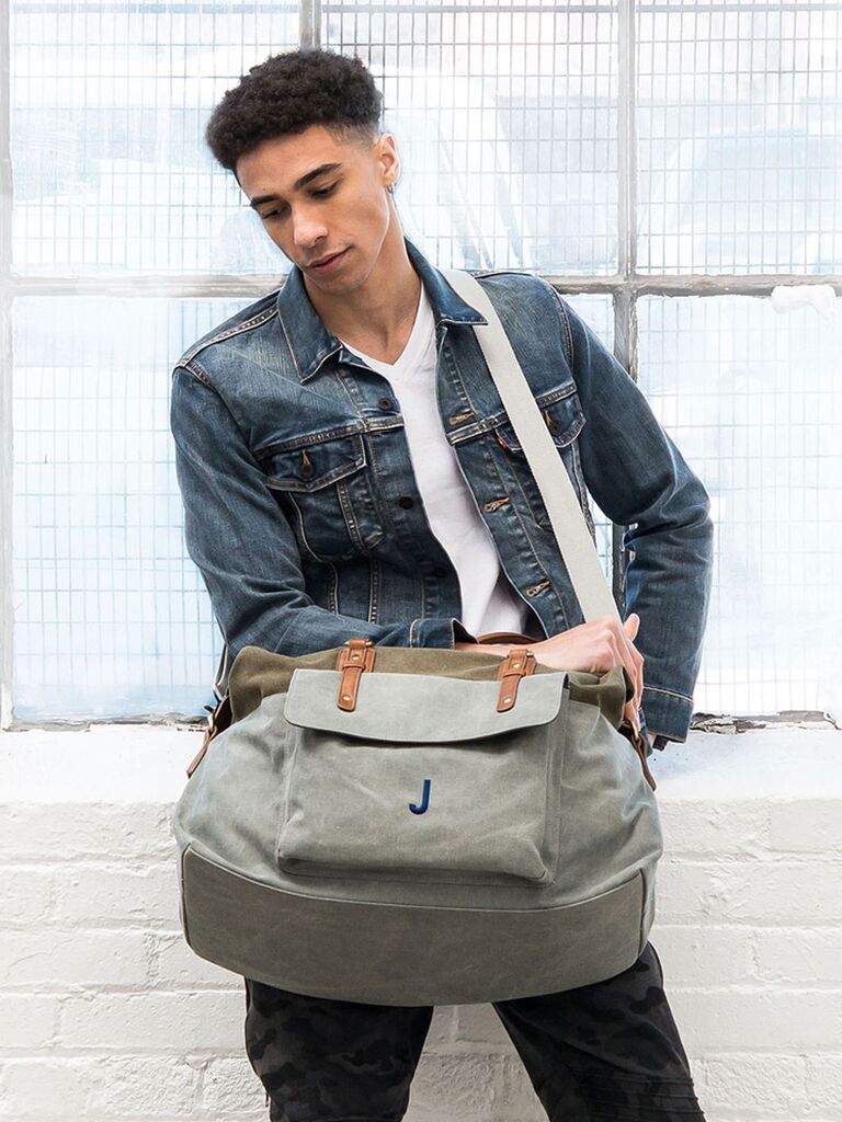 Light gray canvas with faux leather straps and blue initial