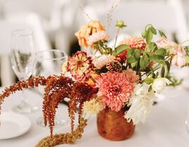 elegant fall wedding centerpiece with orange, blush and coral flowers