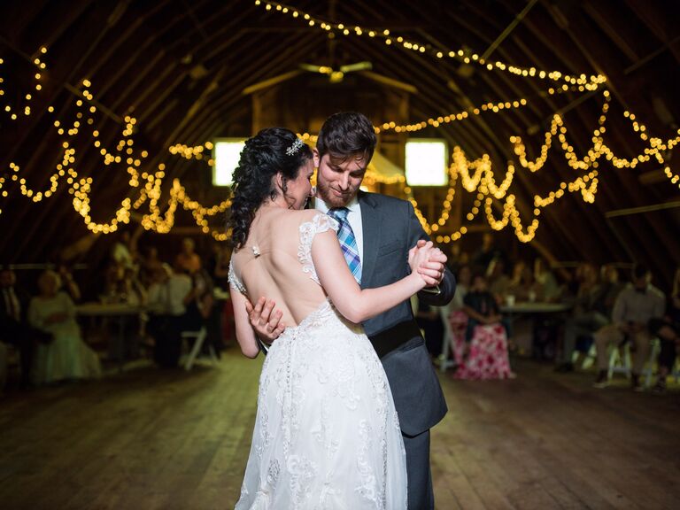 Couple enjoying a slow dance in a barn
