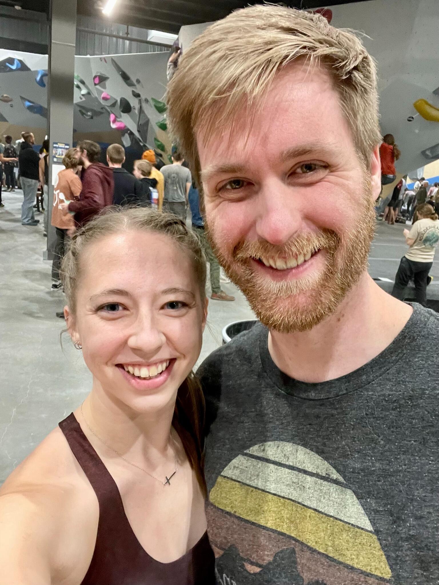 Michael's first of many times being the best cheerleader at Jess's rock climbing competitions