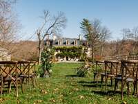 Outside view from the ceremony aisle with the charming house in the background