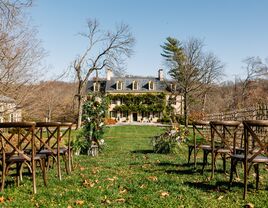 Outside view from the ceremony aisle with the charming house in the background