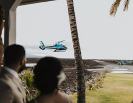 couple looking out at helicopter