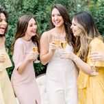 women drinking champagne with bride at bridal shower