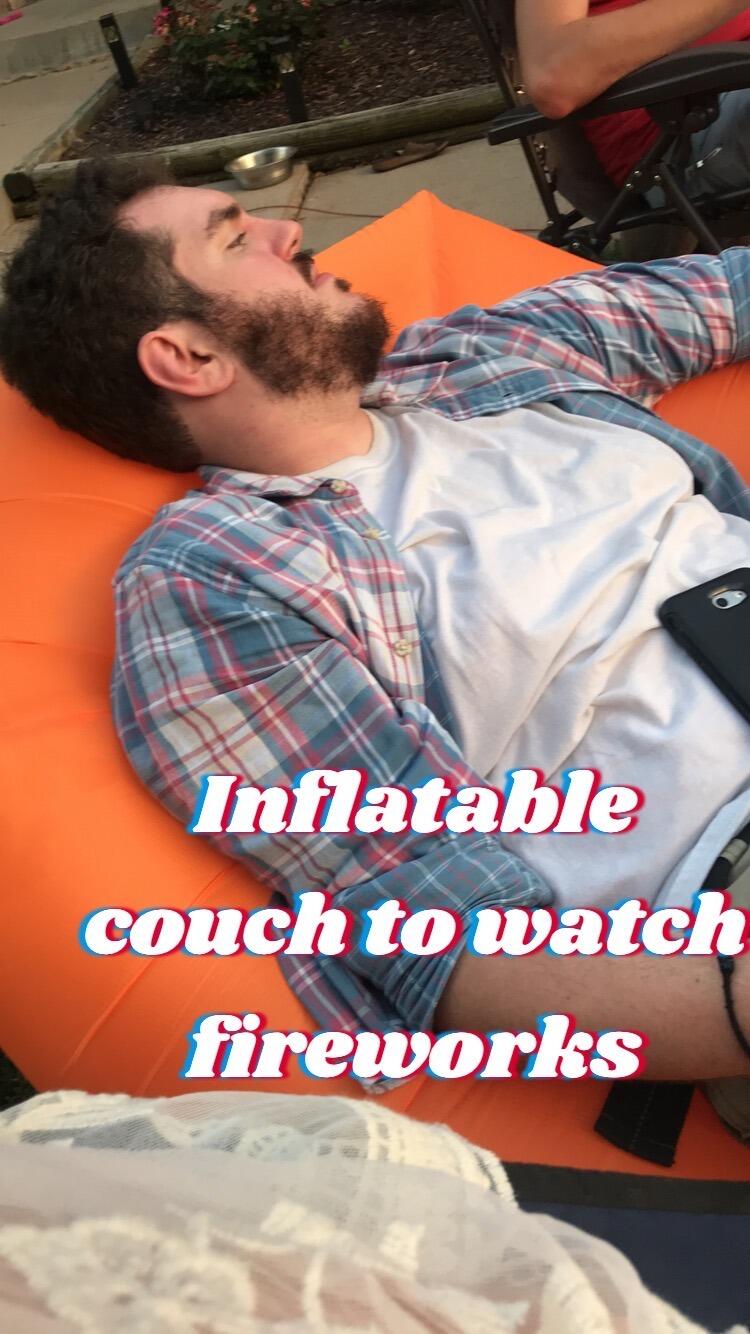 A.J. found the perfect view to watch fireworks... Kat's inflatable couch.