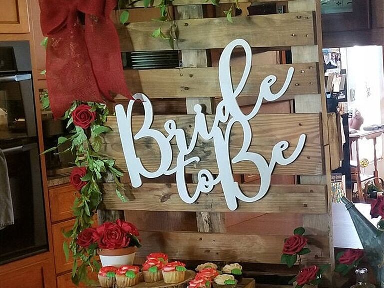 'Bride to be' in white script cutout on wood