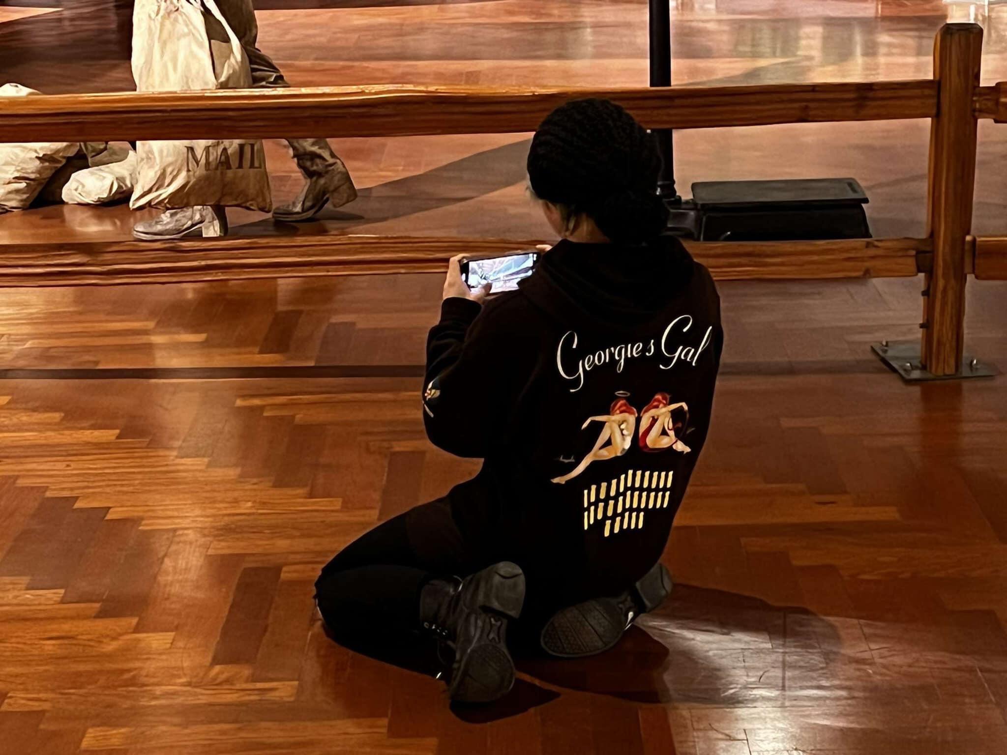 Anthony snuck a picture of Katelyn trying to take a picture of the Tri-Motor since this is how she gets good angles for her pictures.