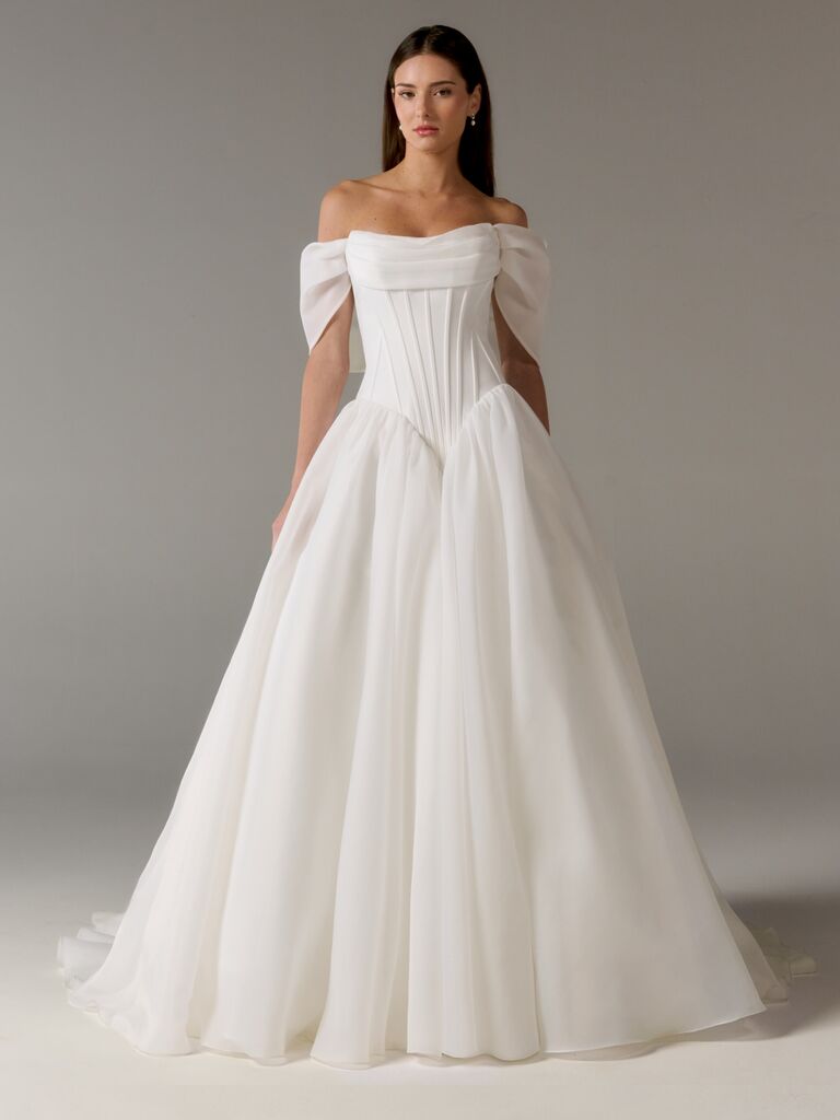 Off-the-shoulder Poeza wedding dress with boning on elongated bodice and V-waistline