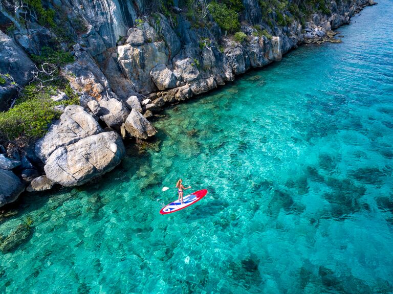 lovango cay views of paddleboarding sup and crystalline water