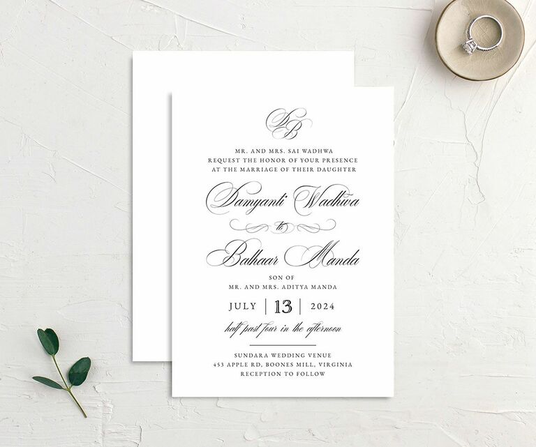 White wedding invitation with vintage scroll calligraphy