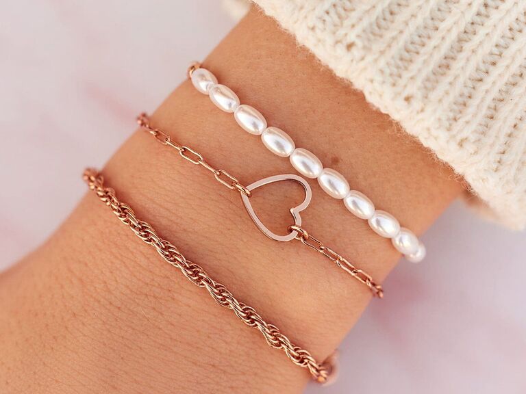 A set of rose gold and pearl bracelets from Pura Vida