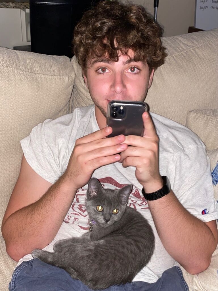 Topher and Sushi bonding. He's still her favorite person (chair).
