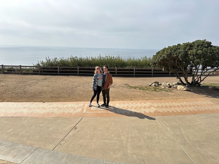 Adam and Ella touring the wedding venue together. 