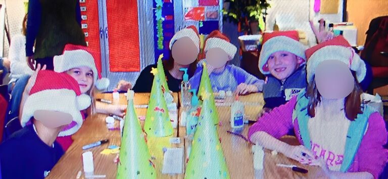 Sitting across from each other at our 3rd Grade Christmas Party. 