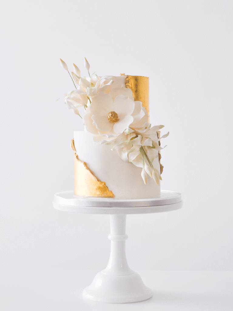 Small wedding cake with gold and grassy accents
