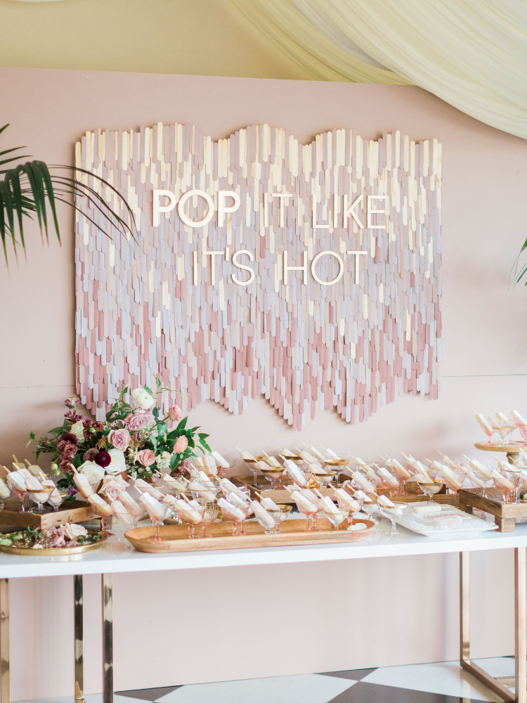 Popsicle station with pink backdrop