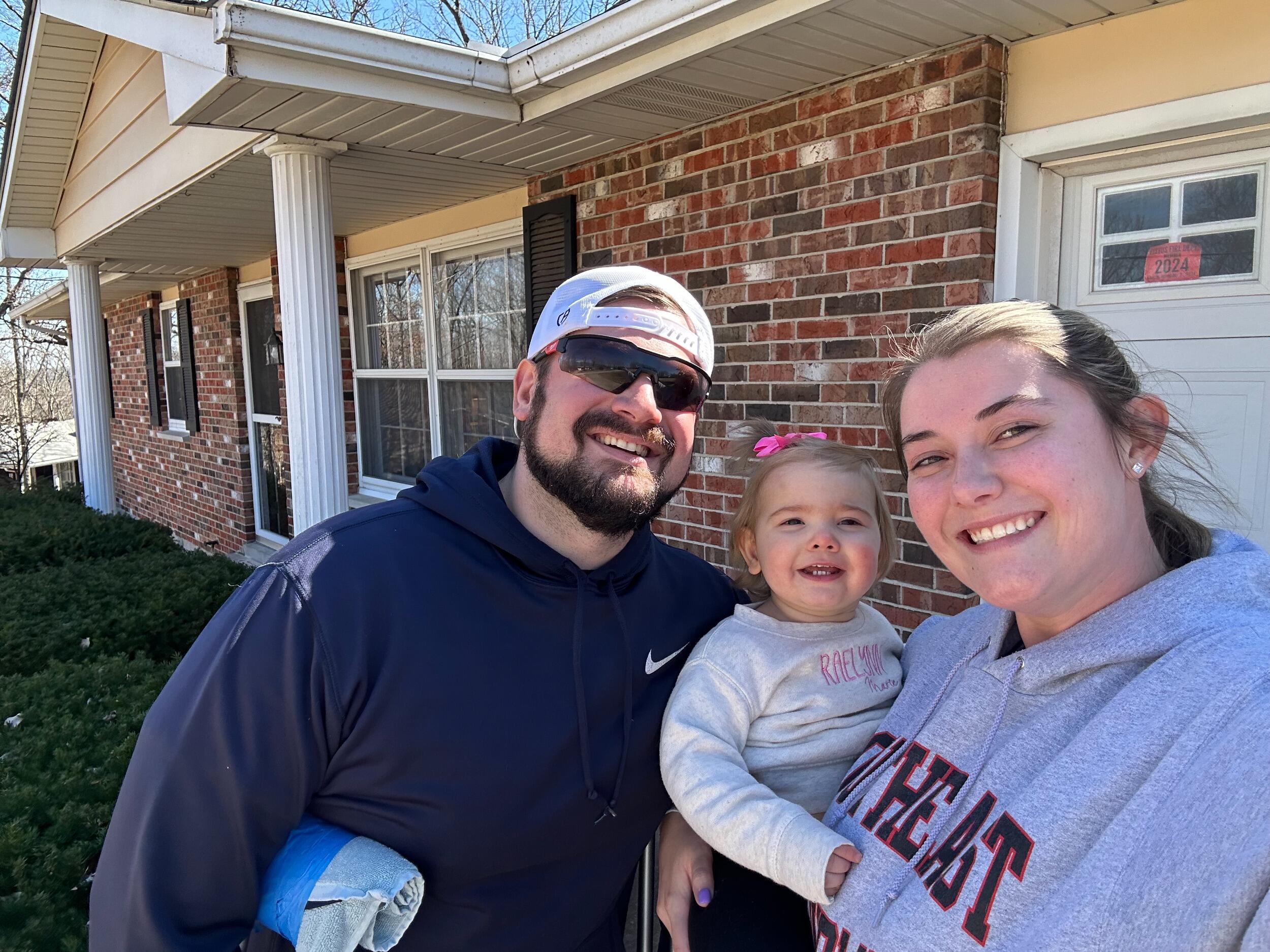 First family picture in front of the new house!