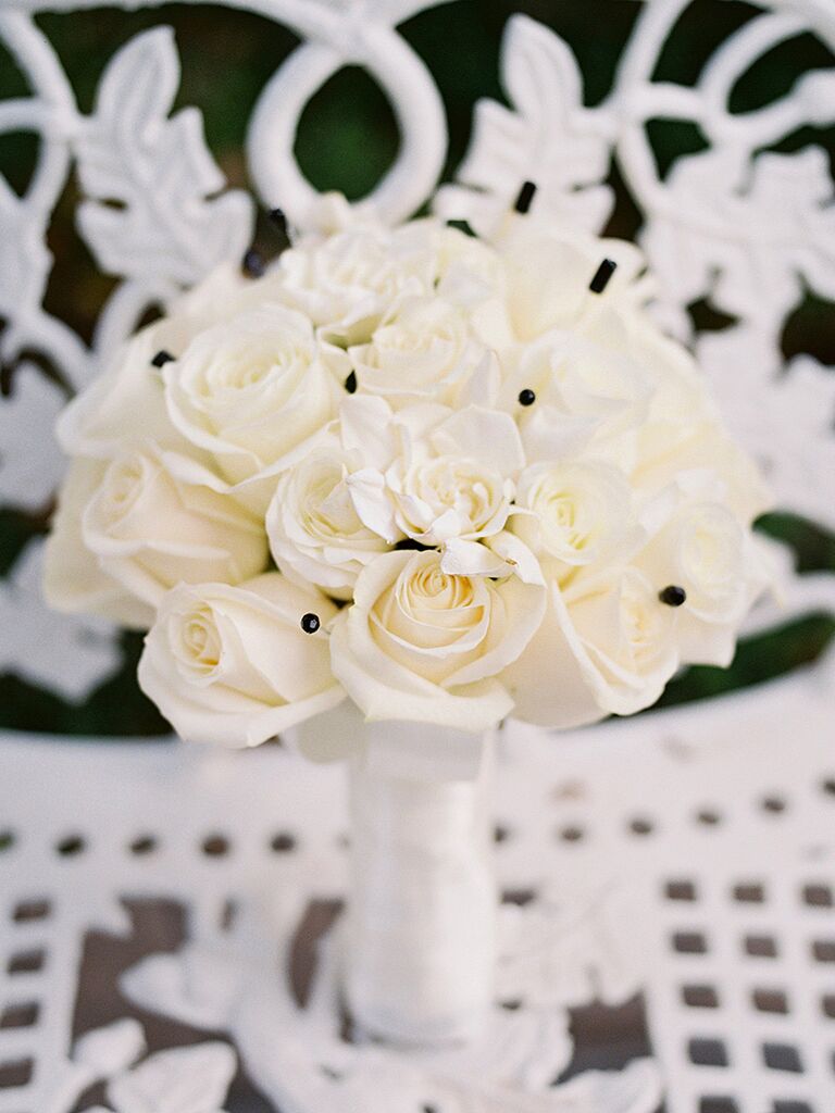 Modern white wedding bouquet with black bouquet pins