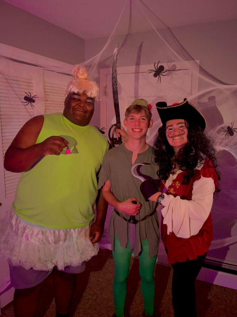 The best Halloween costume-- Crystian as Peter Pan, Mary as Hook, and Malik as Tinkerbell. The year before we were Miss Piggy and Kermit the Frog.