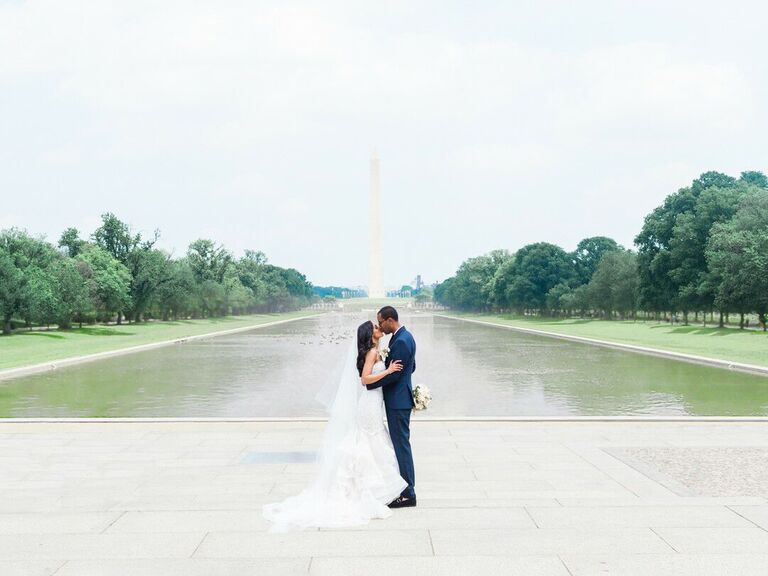 Newlyweds in front of monument in Washington, DC