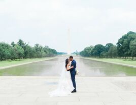 Newlyweds in front of monument in Washington, DC