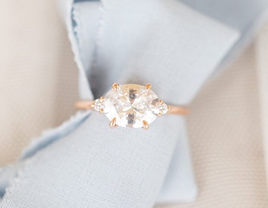 oval-cut east-west engagement ring by Susie Saltzman