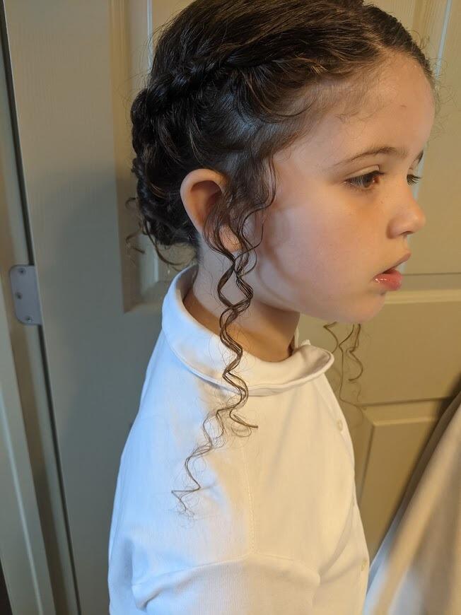 Laura styled Makayla's hair when she was the flower girl in her older brother's wedding.