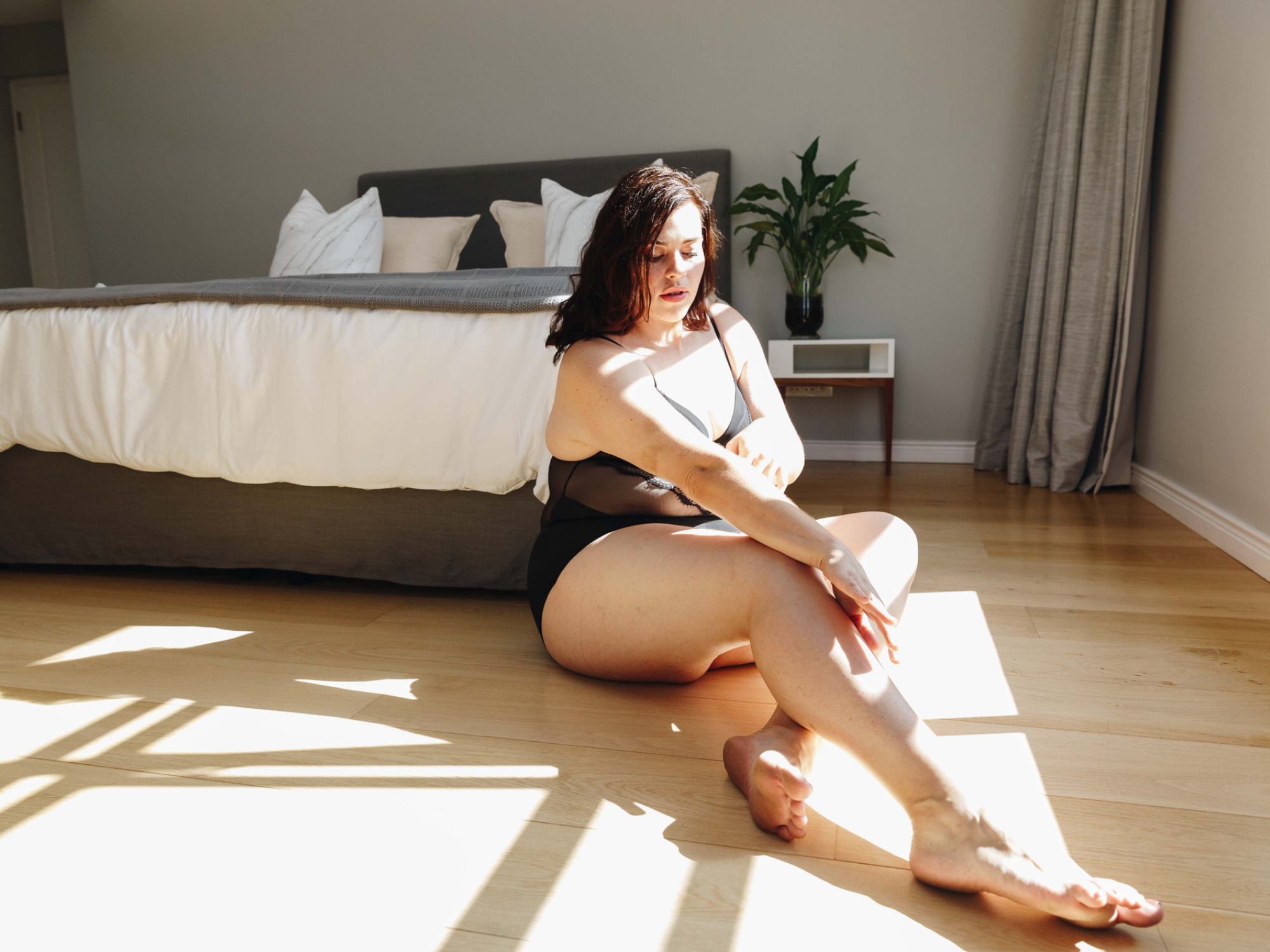 Woman in lingerie posing for boudoir photo, Dallas boudoir photographers