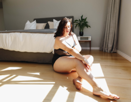 Woman in lingerie posing for boudoir photo, Dallas boudoir photographers