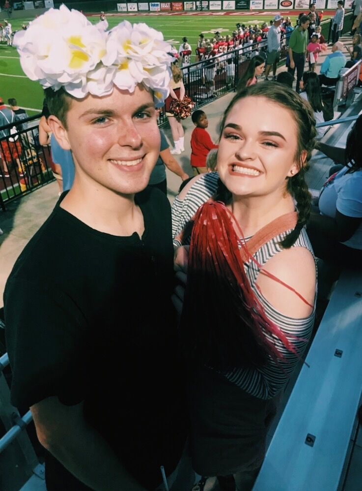 Lara was introduced to Chandler at VBS through a mutual friend. They immediately hit it off. This picture is Chandler attending a football game at Lara's school - Christian Heritage.