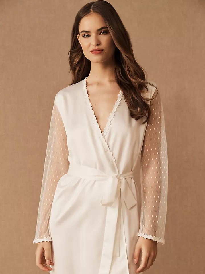 A model shows off this Lace Bridal Robe With Floral Applique, featuring long sleeves and a tie at the natural waist.