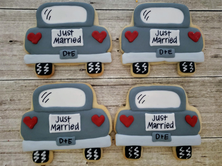 Sugar cookies decorated as back of car with 'just married' sign