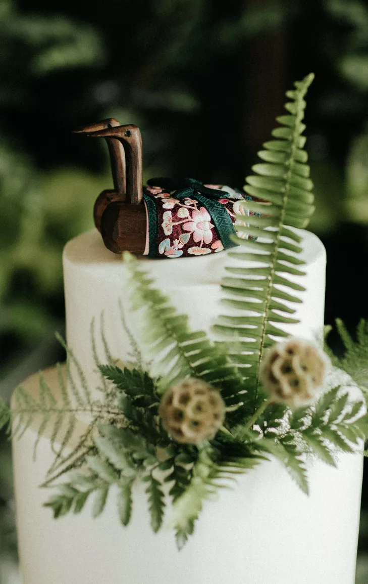 Wood geese as wedding cake topper at Korean wedding