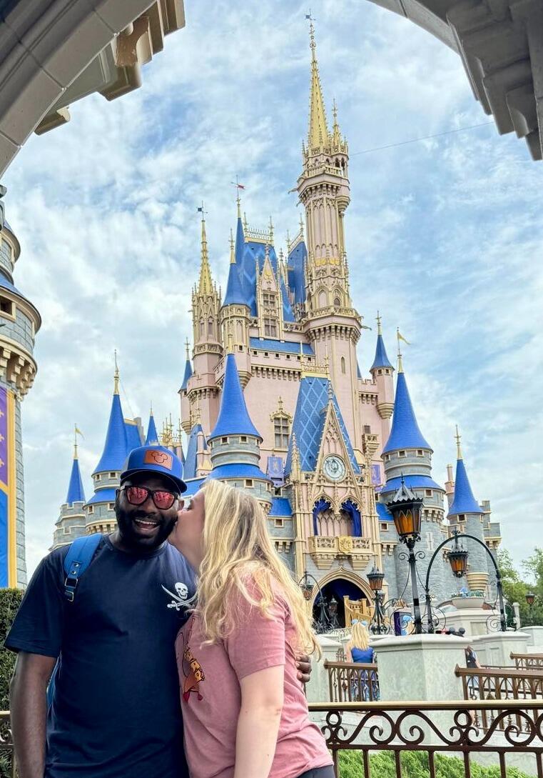 Snuck a kiss in front of the Magic Kingdom castle!