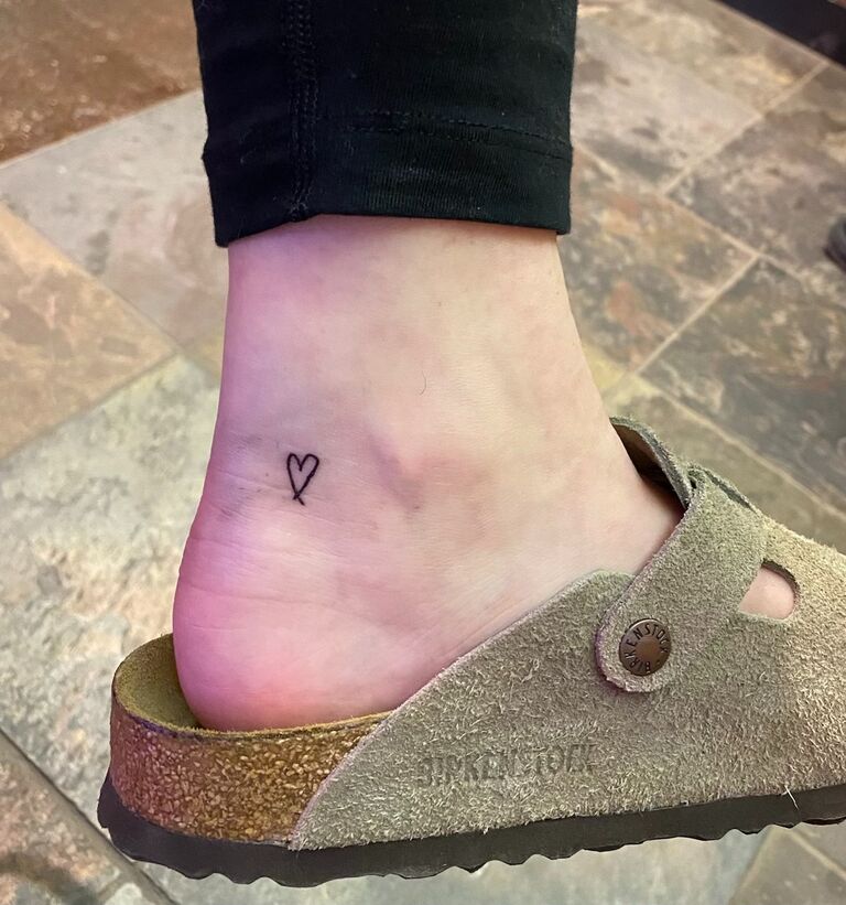 Celebrating Sarah's 23rd birthday by getting tattoos of hearts in each other's handwriting.