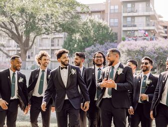 Groom and groomsmen wearing suits