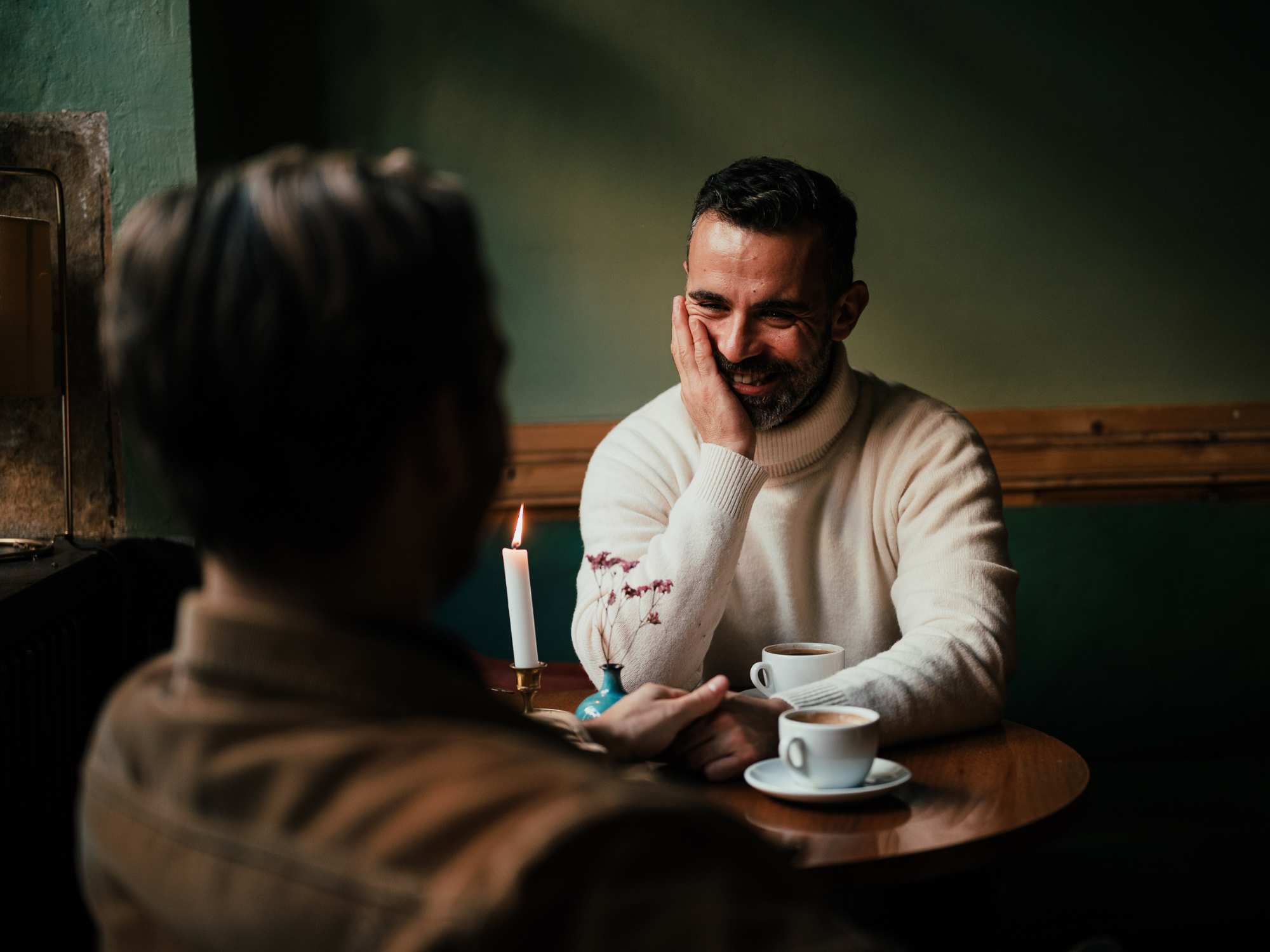 Men sitting at table on first date